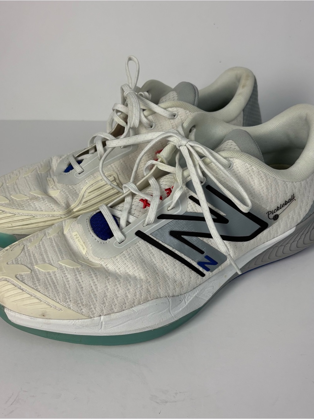 New Balance White Athletic Sneakers with Teal and Navy Accents